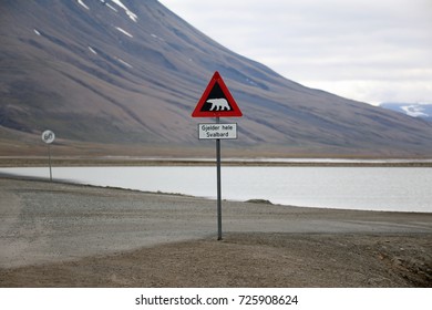 Last Public Sign Leaving Longyearbyen City At Svalbard Island. The Warning That You Have To Have Gun As Protection Against Polar Bears