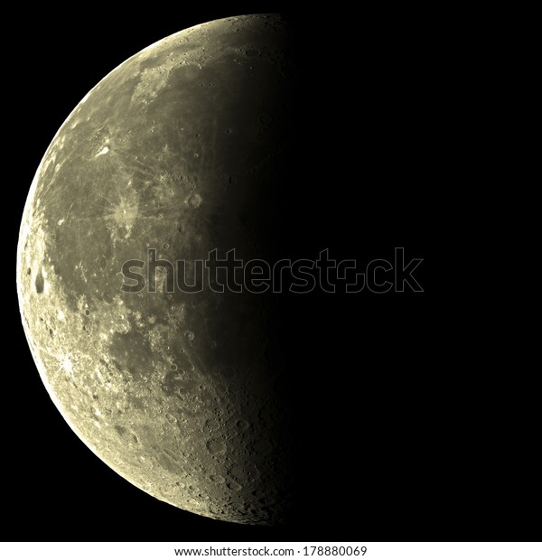 Last quarter Moon on\
a black background.