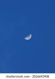 Last Quarter Moon Over Blue Sky