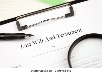 Last Will and testament blank document on A4 tablet lies on office table with pen and magnifying glass close up