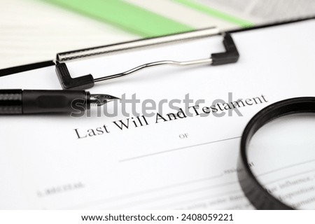 Last Will and testament blank document on A4 tablet lies on office table with pen and magnifying glass close up