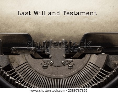Last will and testament on a typewriter with a blank page ready for writing someone's last wishes for their family