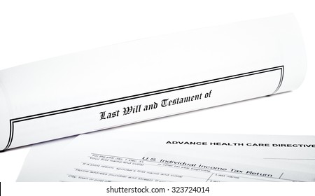 Last Will And Testament Rolled Up With Advance Health Care Directive  And Tax Return Isolated On White