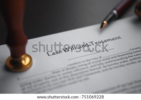 Last will and testament with wooden judge gavel; document is mock-up not rea