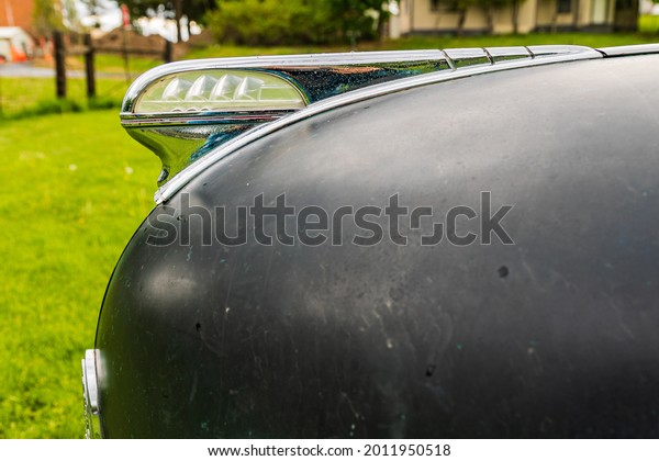 Latah, Washington, USA. May 24,\
2021. Hood ornament on a vintage Plymouth Super De Luxe\
automobile.