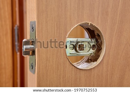 Latch assembly is inserted into door hole during installation.