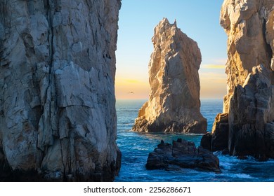 Late afternoon sun hits a rock formation near El Arco arch at the Land's End coastal region at Cabo San Lucas, Mexico, on the Baja Peninsula.