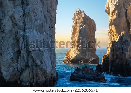 Late afternoon sun hits a rock formation near El Arco arch at the Land's End coastal region at Cabo San Lucas, Mexico, on the Baja Peninsula.