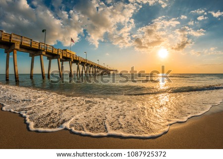 late afternoon sun over Gulf of Mexico and Venice Pier in Venice Florida