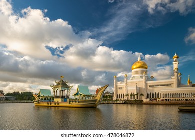 The late afternoon sun sets over Bandar Seri Begawan, Brunei, and strikes the facade of the Sultan Omar Ali Saifuddin Mosque.