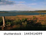 Late afternoon sun settling in over Lake Heron in New Mexico with views of the mountains in the distance 