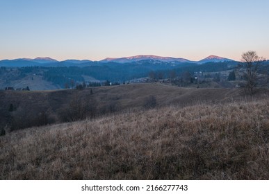 Late autumn mountain countyside sunset scene. Picturesque traveling, seasonal, nature and countryside beauty concept scene. Carpathians, Ukraine. - Shutterstock ID 2166277743