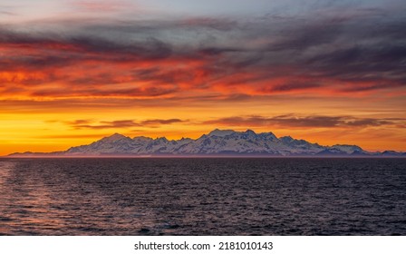 Late Evening Sunset On Panorama Of Mountains And Mount Fairweather By Glacier Bay National Park In Alaska