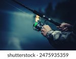 Late Fly Fishing. Angler with Fishing Rod in Hands. Closeup Photo.