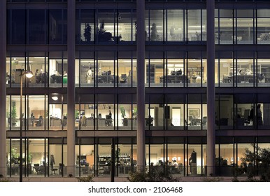 Late Night Overtime In A Modern Office Building.