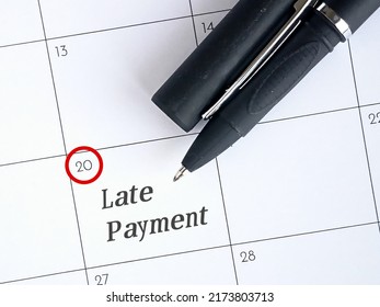 Late Payment Text Reminder With Pen On Calendar. Photo Concept. 