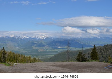 Late Spring In Wyoming: Looking Out From Teton Pass To Jackson Hole, Jackson, Snake River, Gros Ventre Mountains And The Wind River Mountain Range