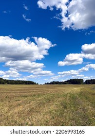 Late Summer Landscape With Empty Field And Blue Sky.