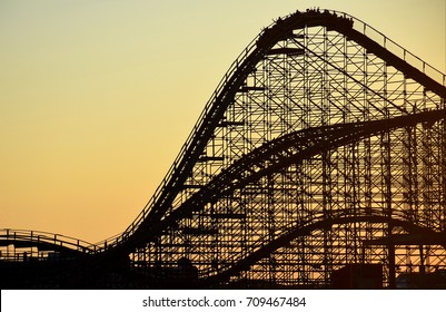 Late Summer Sunset Of A Roller Coaster In Silhouette