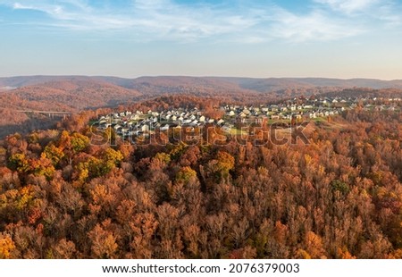Late sun casts warm light on the The Bluffs residential development in Falling Water near Morgantown West Virginia on a beautiful autumn day