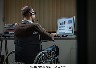 Late working man on wheelchair giving support assistant - Powered by Shutterstock