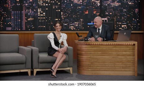 Late-night Talk Show Host Having A Conversation With Celebrity Guest In A Studio. TV Broadcast Style Show