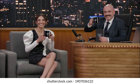 Late-night Talk Show Host Having A Conversation With Celebrity Guest In A Studio. TV Broadcast Style Show