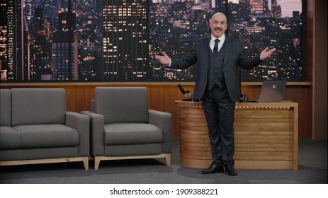 Late-night Talk Show Host Is Performing His Monologue, Looking Into Camera. TV Broadcast Style Show. 