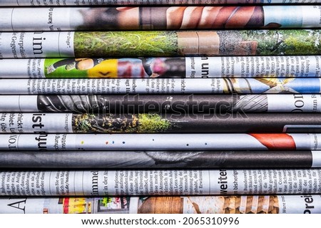 Latest News Concept: A stack of folded newspapers