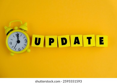 LATEST UPDATE text with notepad, keyboard, decorative vase and fountain pen on wooden background. Business and copy space concept