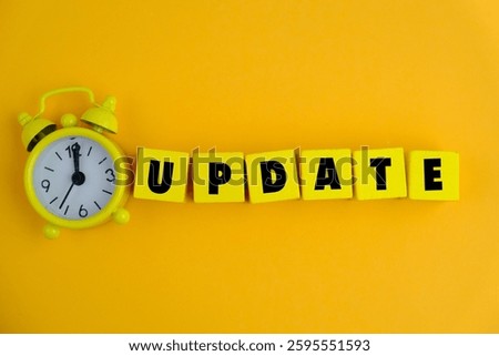 LATEST UPDATE text with notepad, keyboard, decorative vase and fountain pen on wooden background. Business and copy space concept