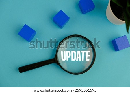 LATEST UPDATE text with notepad, keyboard, decorative vase and fountain pen on wooden background. Business and copy space concept