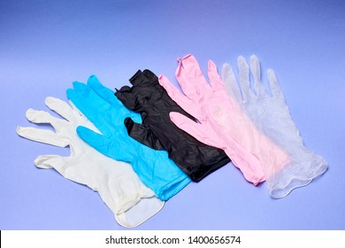 Latex Gloves On A Dark Background. Nitrile Medical Gloves In Different Colors.