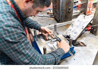 Lathe worker man working with a vernier and milling machine in a factory, using a caliper to check measurement. - Powered by Shutterstock