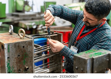 Lathe worker man working with a vernier and milling machine in a factory, using a caliper to check measurement. - Powered by Shutterstock