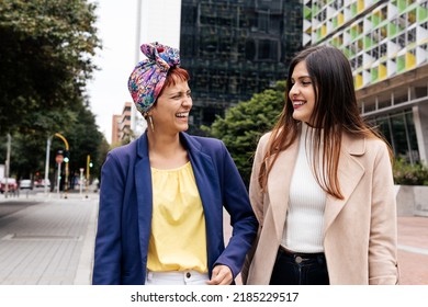 A Latin Adult Two Women Laughing On The Street