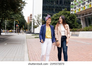 A Latin Adult Two Women Walking On The Street