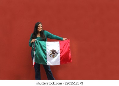 Latin Adult Woman Shows The Flag Of Mexico Proud Of Her Culture And Tradition. Celebrate The Mexican Soccer Team And The National Holidays Of Independence And Cinco De Mayo
