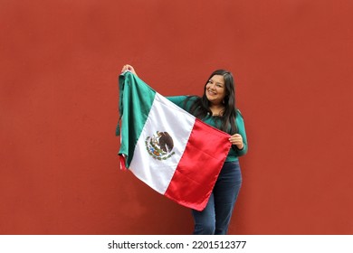 Latin Adult Woman Shows The Flag Of Mexico Proud Of Her Culture And Tradition. Celebrate The Mexican Soccer Team And The National Holidays Of Independence And Cinco De Mayo
