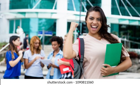 Latin American Female Student Celebrating Successful Exam Outdoor On Campus Of University