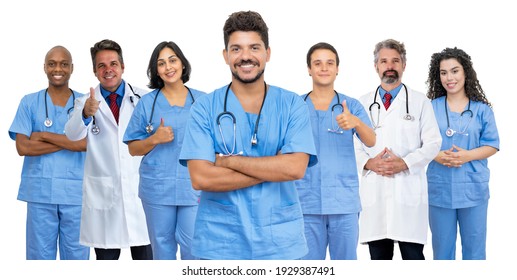 Latin American Male Doctor With Motivated Medical Team Isolated On White Background For Cut Out