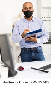 Latin American Male Wearing Face Mask At His Office