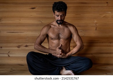 Latin American Male Yogi Seated In The Limgan Mudra Position. Concept Of Yoga And Meditation