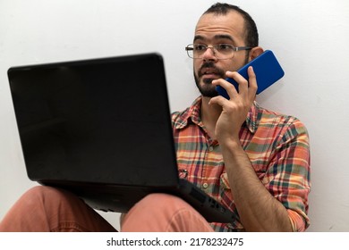 Latin American Man With His Laptop Computer Is A Programmer And Specializes In Web Development.