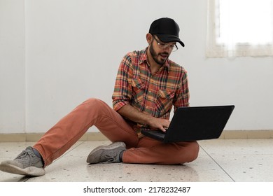 Latin American Man With His Laptop Computer Is A Programmer And Specializes In Web Development.