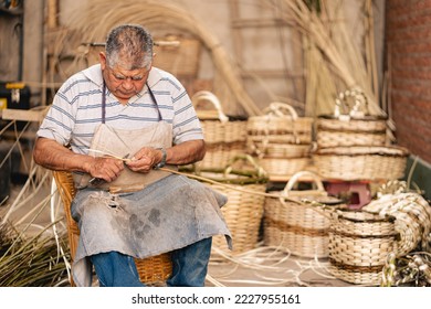 Latin American old man working at his workshop of wicker baskets. Latin American Argentinian culture, tradition and art - Powered by Shutterstock