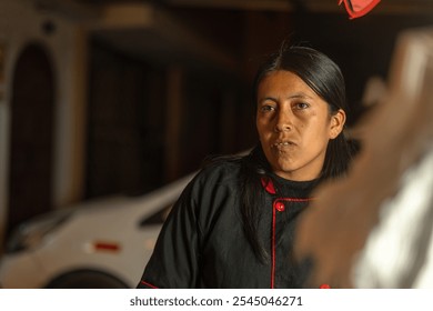 Latin american woman working at her chicken broaster food stall, serving a customer on a blurry background - Powered by Shutterstock