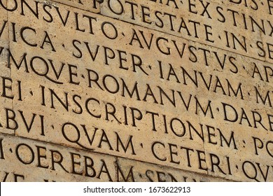 Latin Ancient Language And Classical Education. Inscription From Emperor Augustus Famous Res Gestae (1st Century AD), With The Word Romanum In The Center