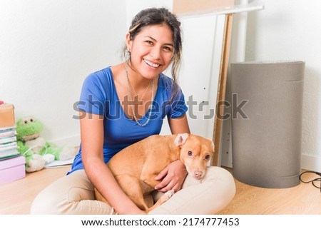 Latin Bolivian young female student independence moving home apartment for university with pet