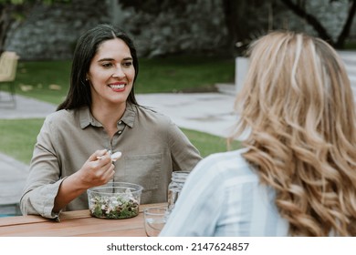 Latin Business Women Middle Age And Colleagues Eating Salad At The Office Terrace In Mexico Latin America	